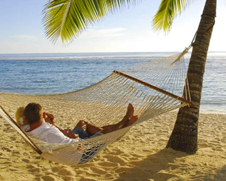 Relaxing on the beach at Crown Beach Resort & Spa - image courtesy of Crown Beach Resort & Spa.